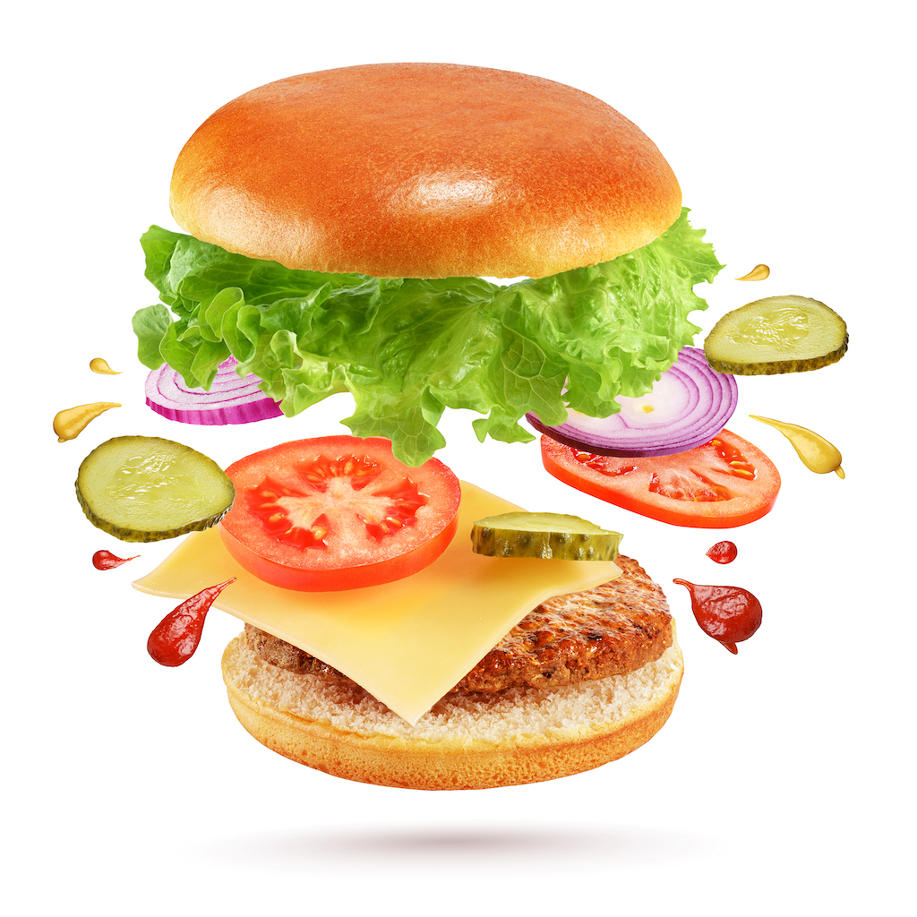 flying-cheeseburger-isolated-on-white-background-FTQ56CJ